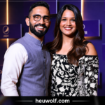 Deepika Pallikal posing with her husband at a public event with a purple backdrop.